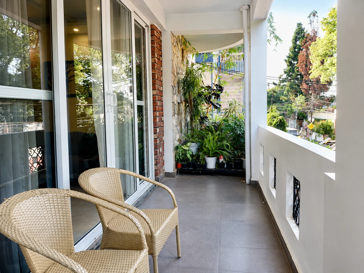 Spacious outdoor balcony sitting area at the best homestay in Dehradun Dalanwala
